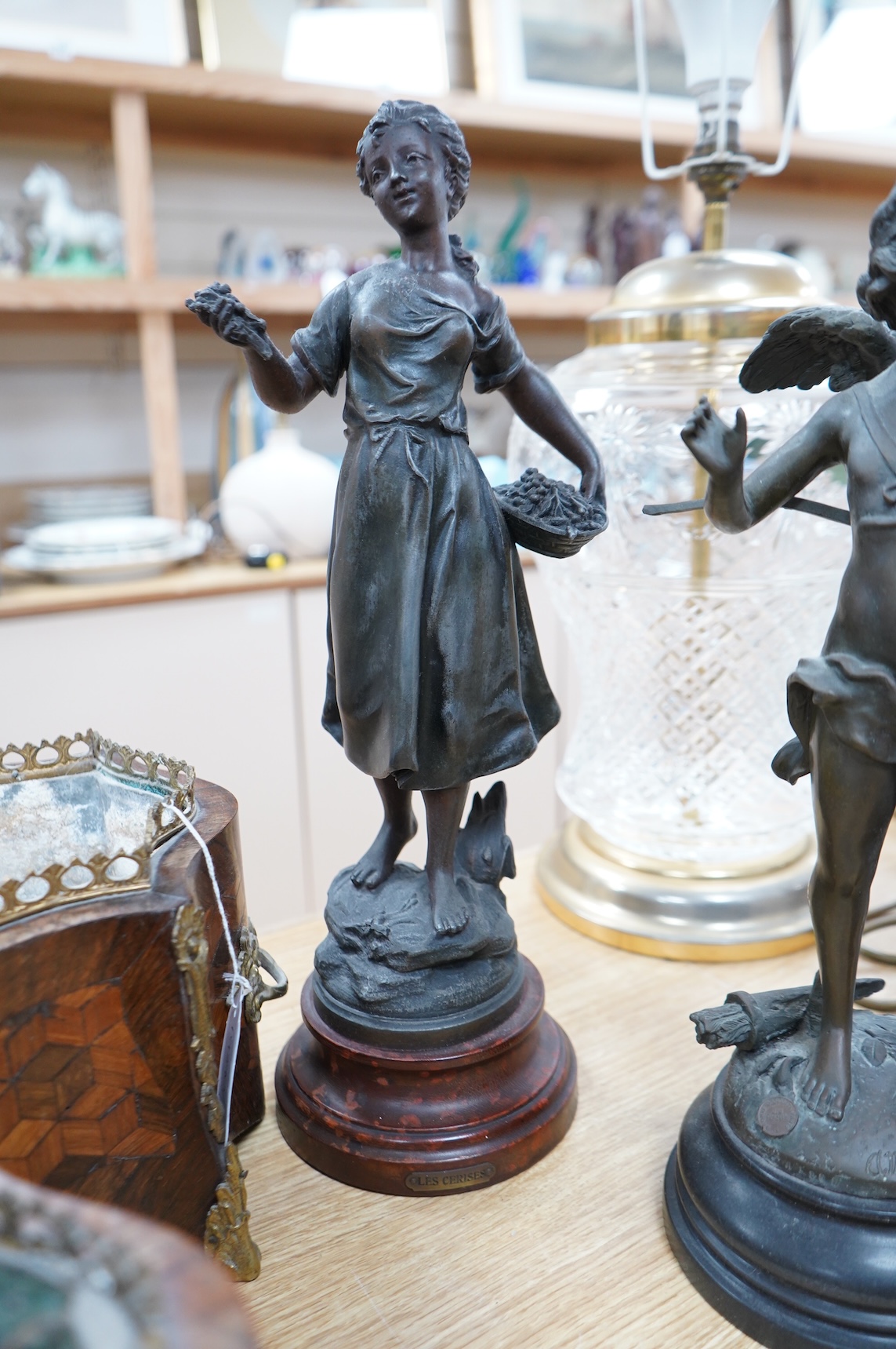 After Moreau - three statuettes, two bronze cherubs and a patinated spelter maiden, ‘Les Cerises’